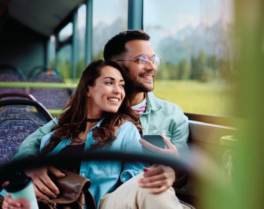 A couple looks out of the window of a bus Decorative picture