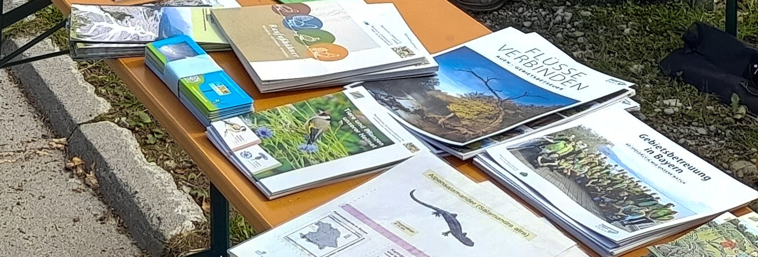 There are information brochures on a beer table about company support