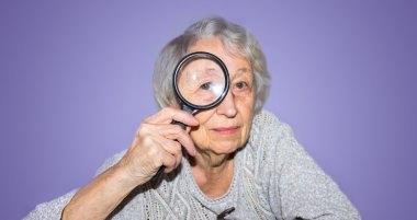 Woman with a Magnifying Glass A woman looks at the viewer through a magnifying glass
