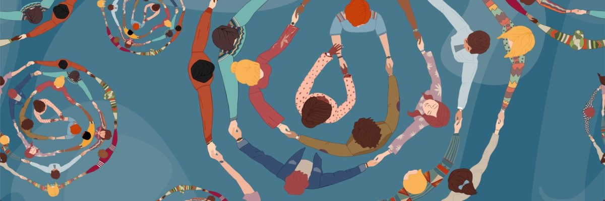 Group of different people holding hands in a circle from different cultures. A community of men and women, friends or volunteers.