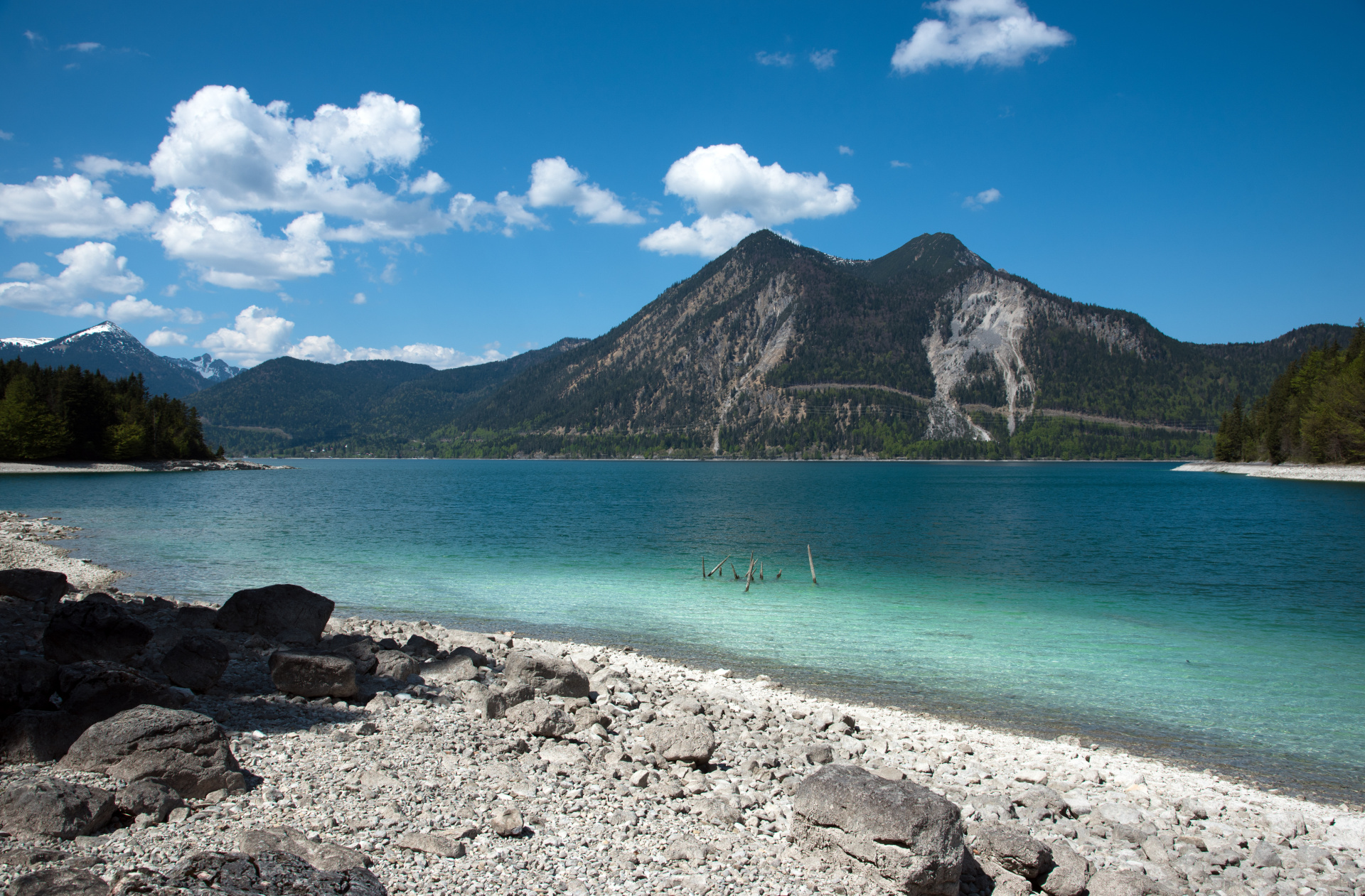 Shot from the stony shore of Walchensee with a view across the lake to the mountains.